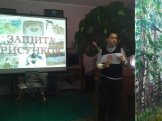 Куликов Виталий защищает рисунок по произведению В.Астафьева “Конь с розовой гривой”